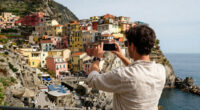 This Cliffside Italian Village Was Named The Happiest Place To Travel In Europe—and It Has Colorful Houses And Pebble Beaches